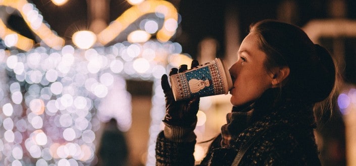 woman drinking coffee at night 