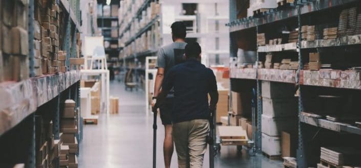 Men Going Around a Warehouse
