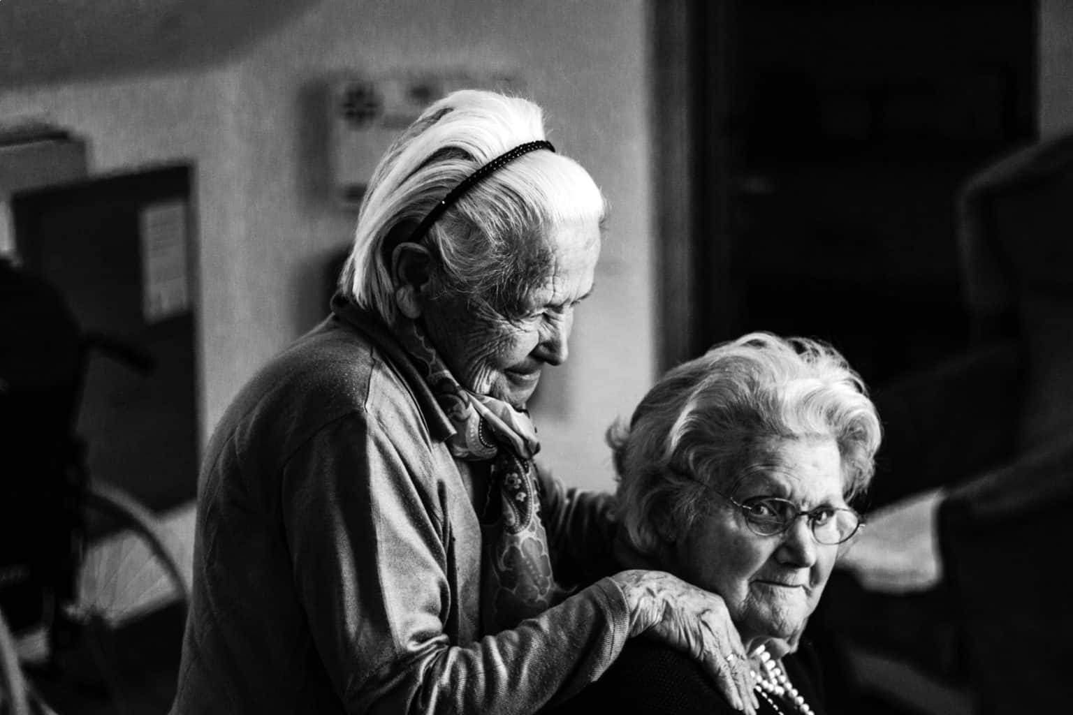 A black and white photo of two old women 