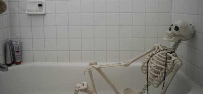 skeleton inside a bathtub