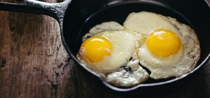 two fried eggs on skillet 