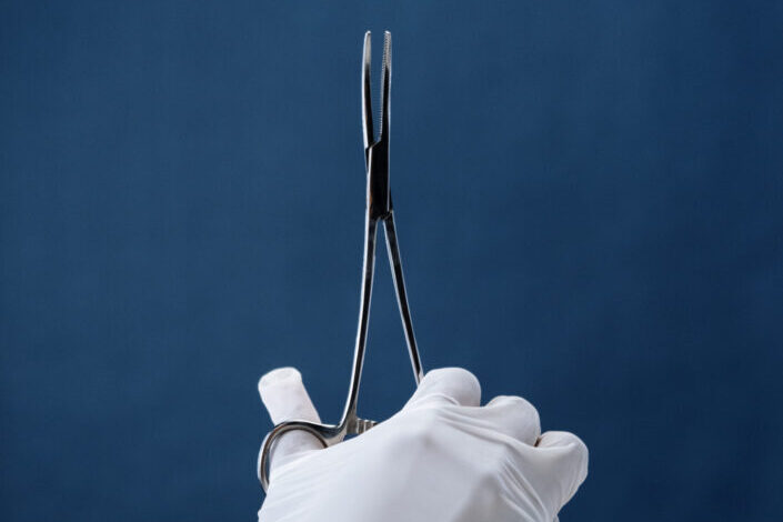 Person Holding Forceps