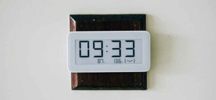 white and brown wooden digital clock