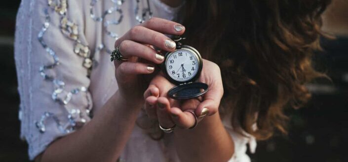 Woman with an old pocket watch