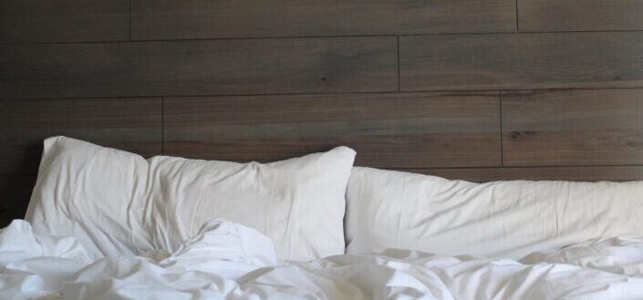 Bed With White Sheets and White Pillows